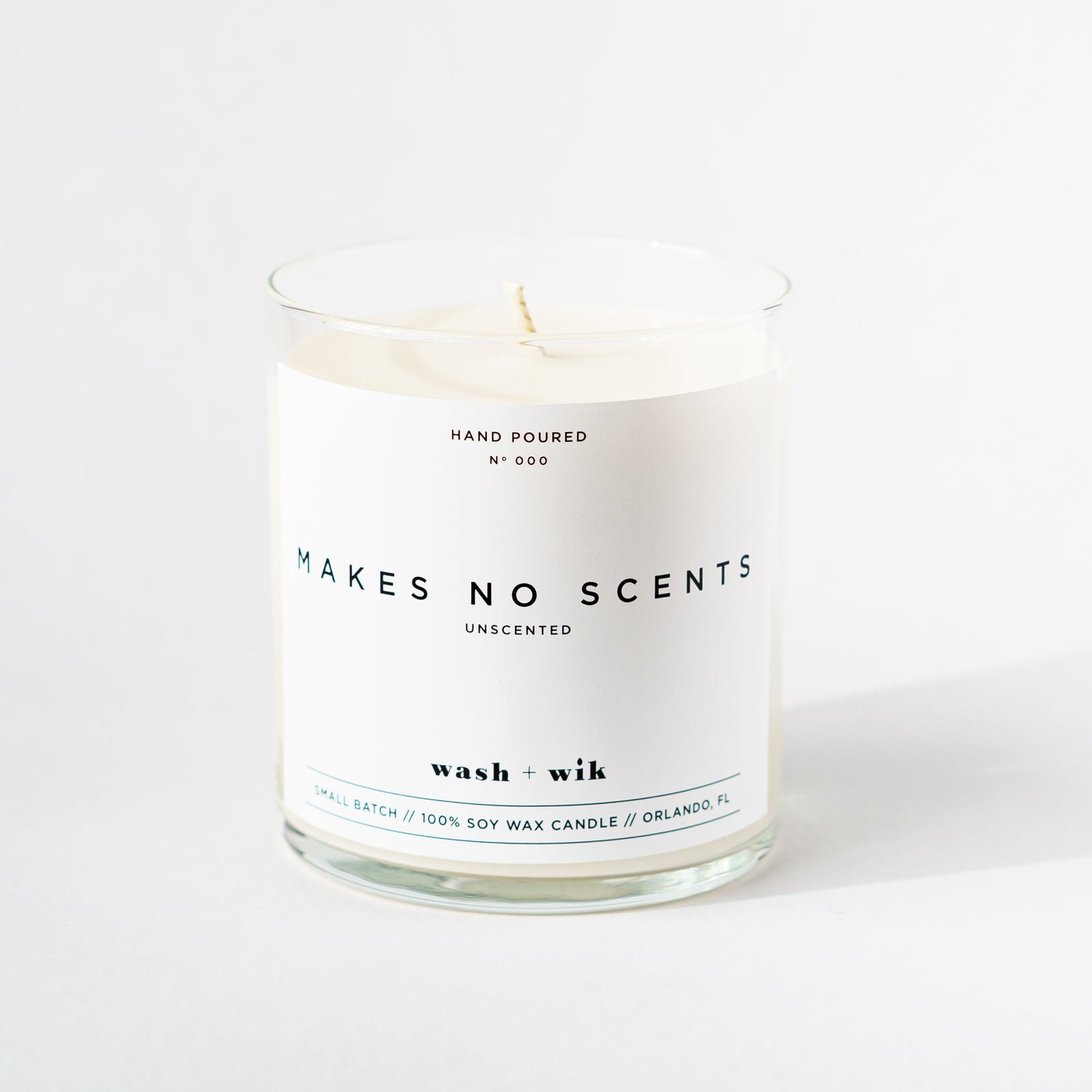 Unscented candle with 'Makes No Scents' label on a white background