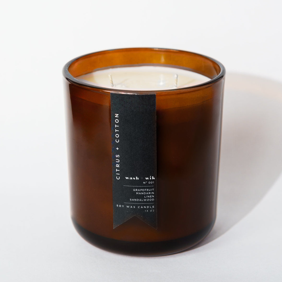 Brown candle with a label on a white background