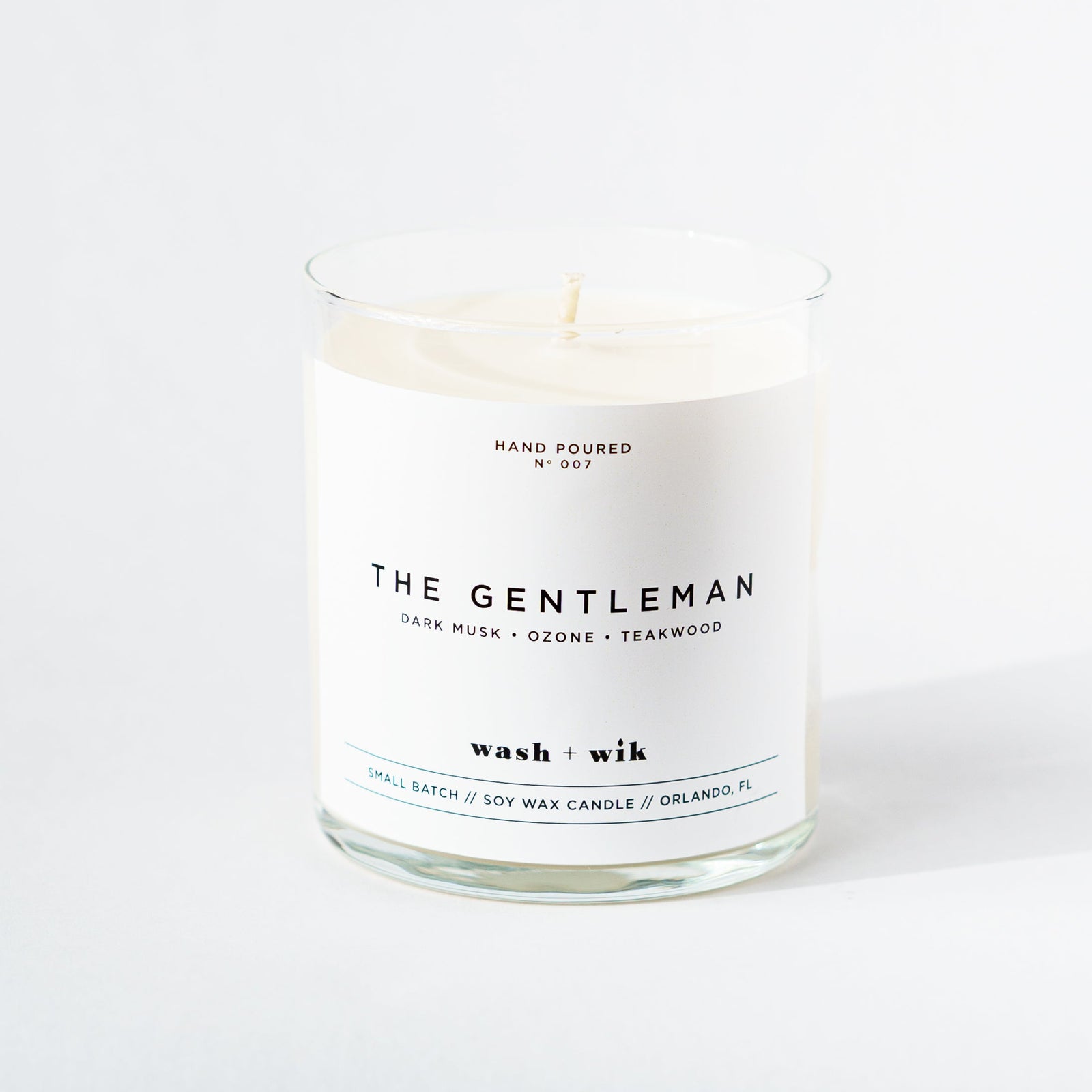 Candle labeled 'The Gentleman' on a white background