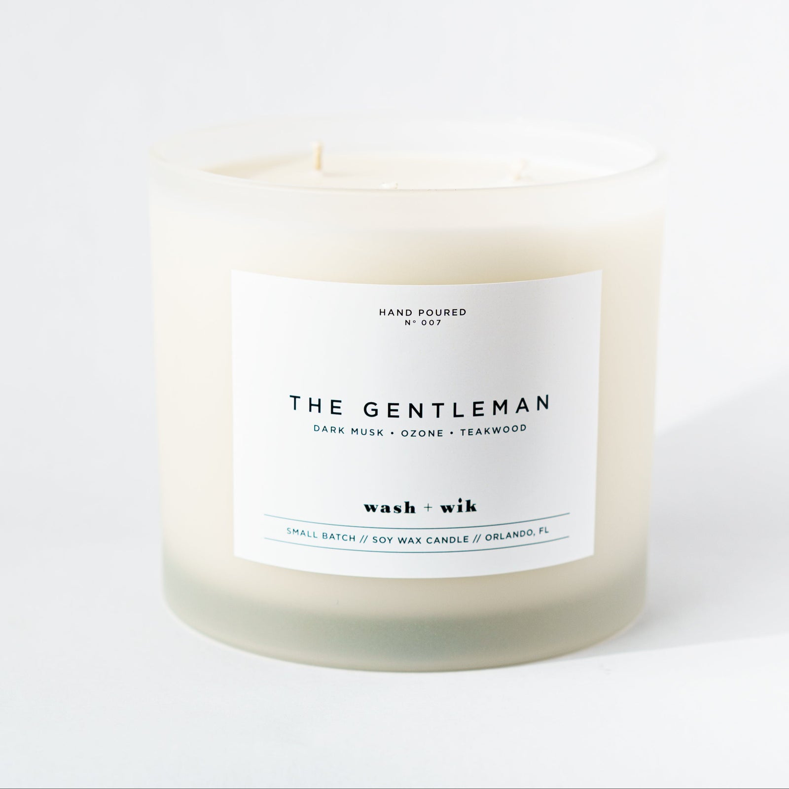 Candle labeled 'The Gentleman' on a white background