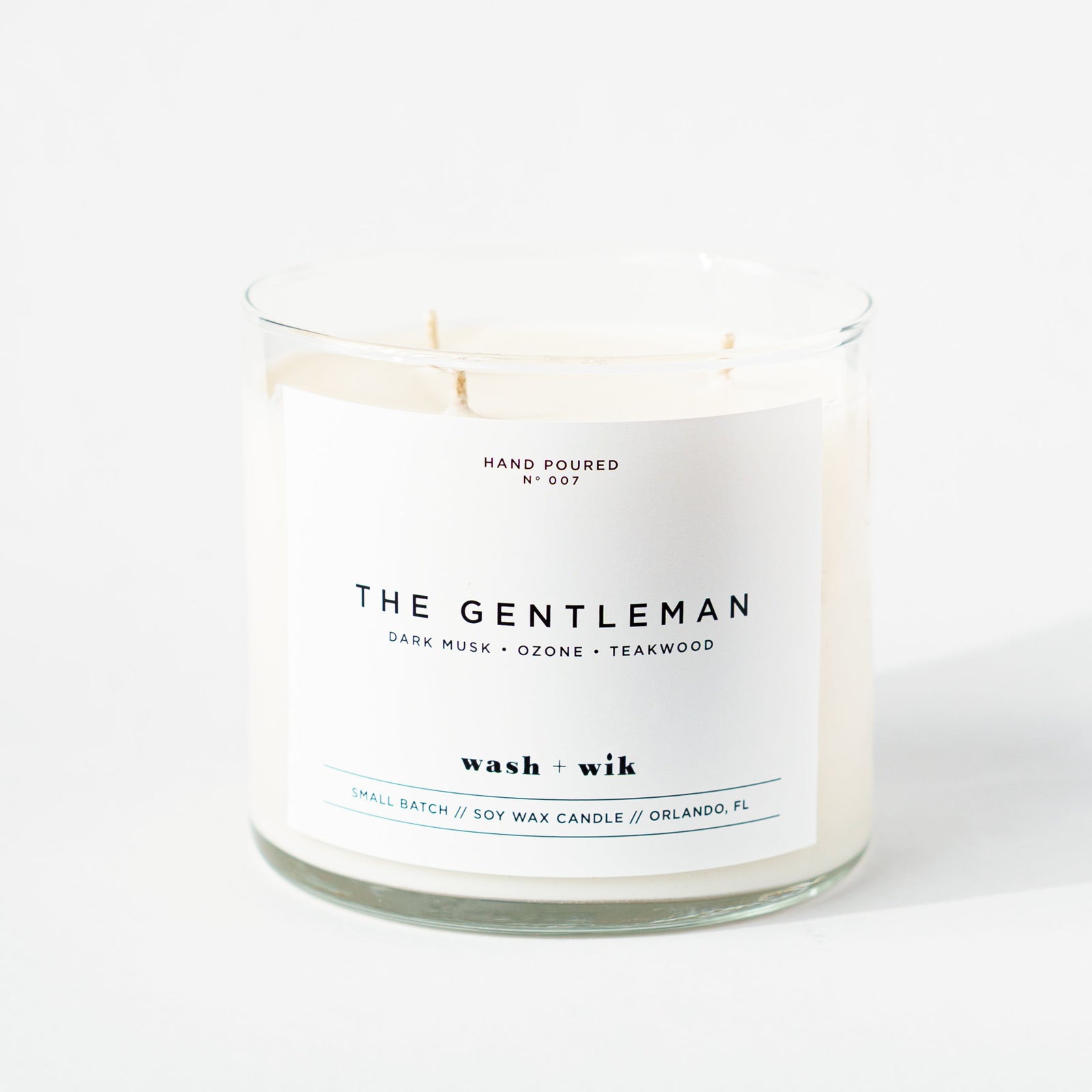 Candle labeled 'The Gentleman' on a white background