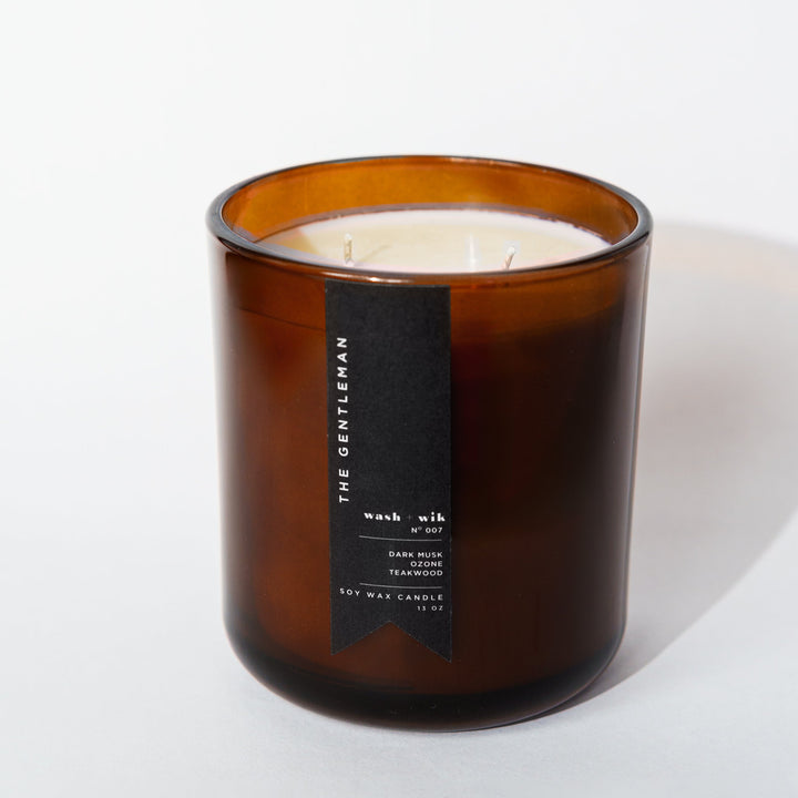 Brown candle with a label on a white background