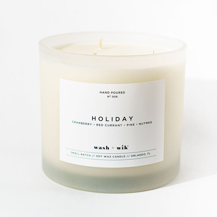 White candle with a label on a white background
