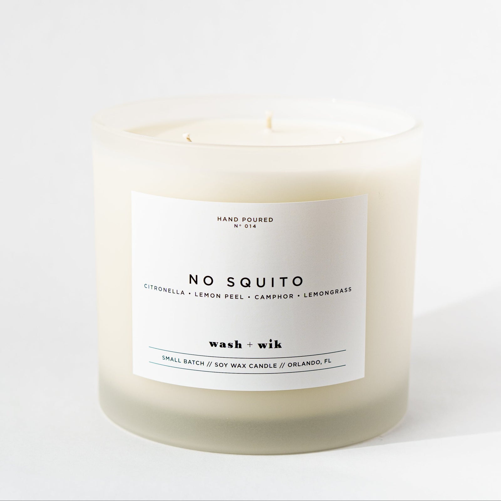 Candle with a label on a white background
