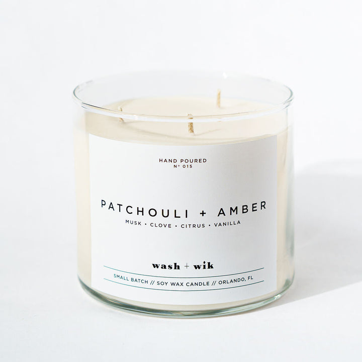 Candle with a label reading &