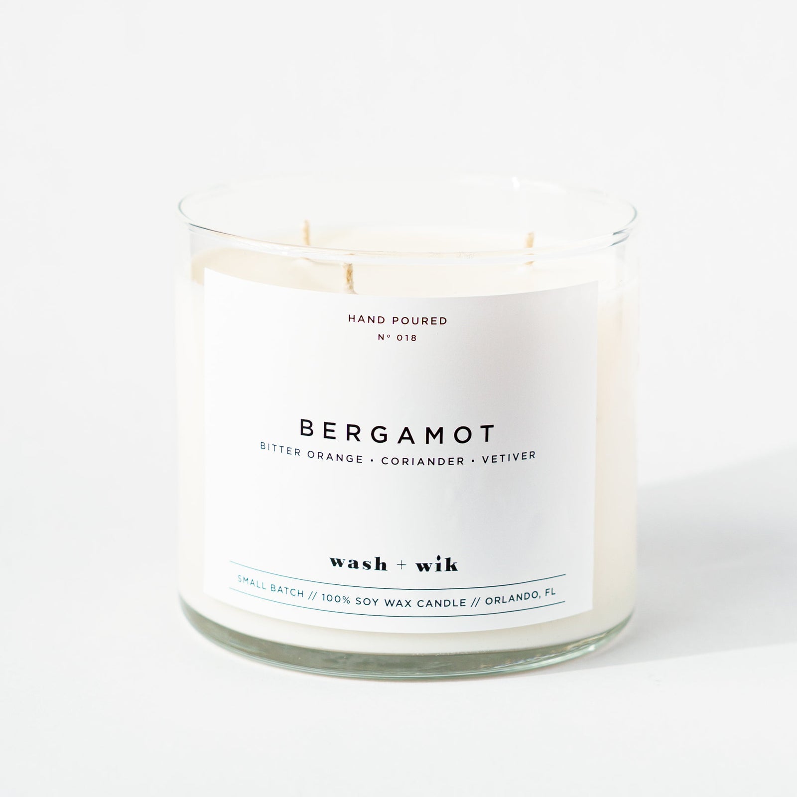 Candle with 'Bergamot' fragrance on a white background
