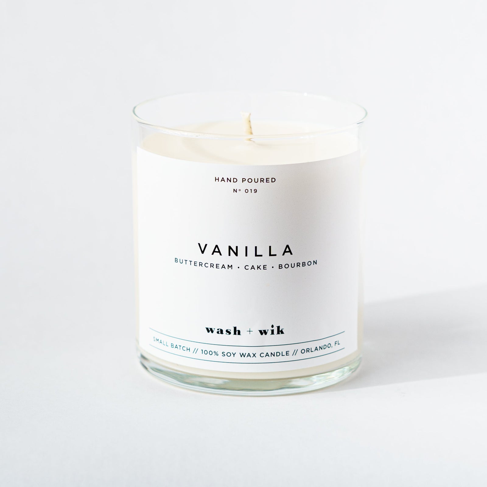 Vanilla candle with a white label on a white background