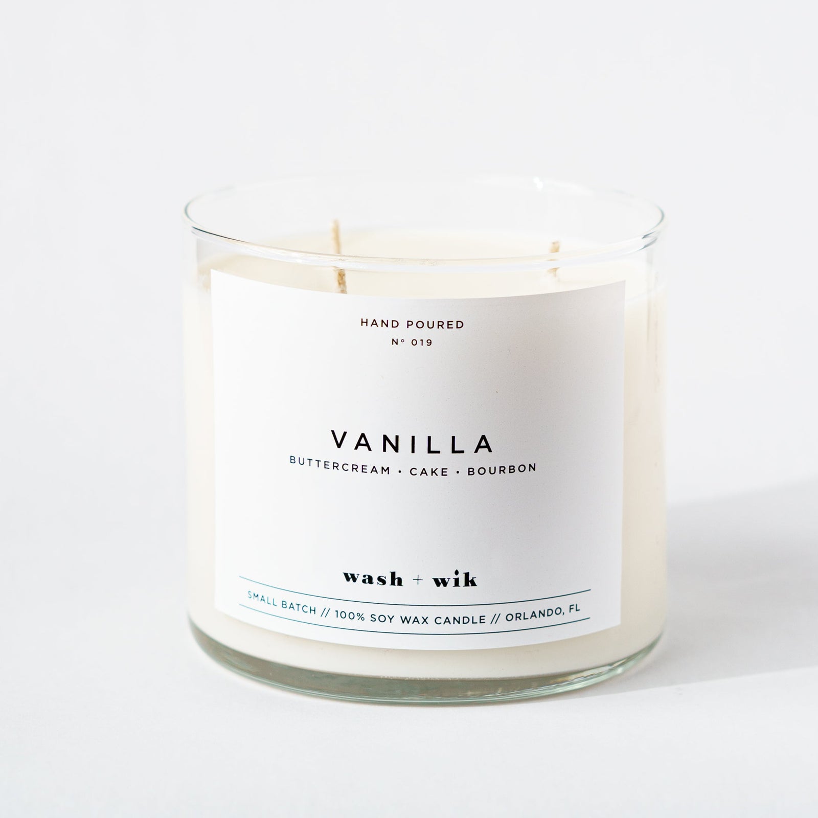 Vanilla candle with a white label on a white background