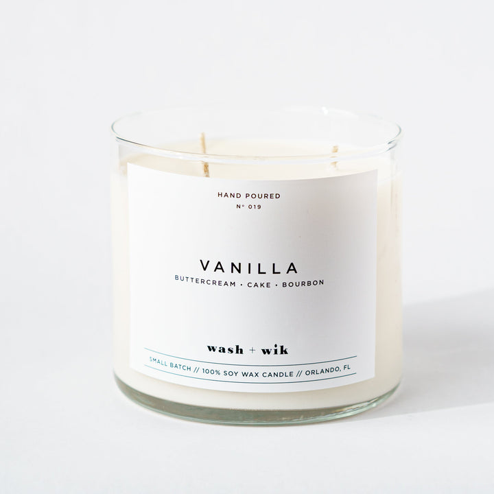 Vanilla candle with a white label on a white background