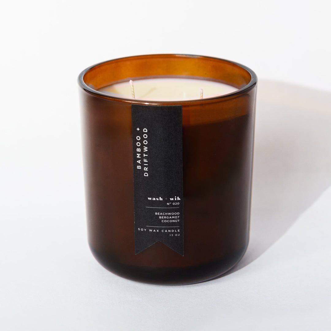 Brown candle with a label on a white background
