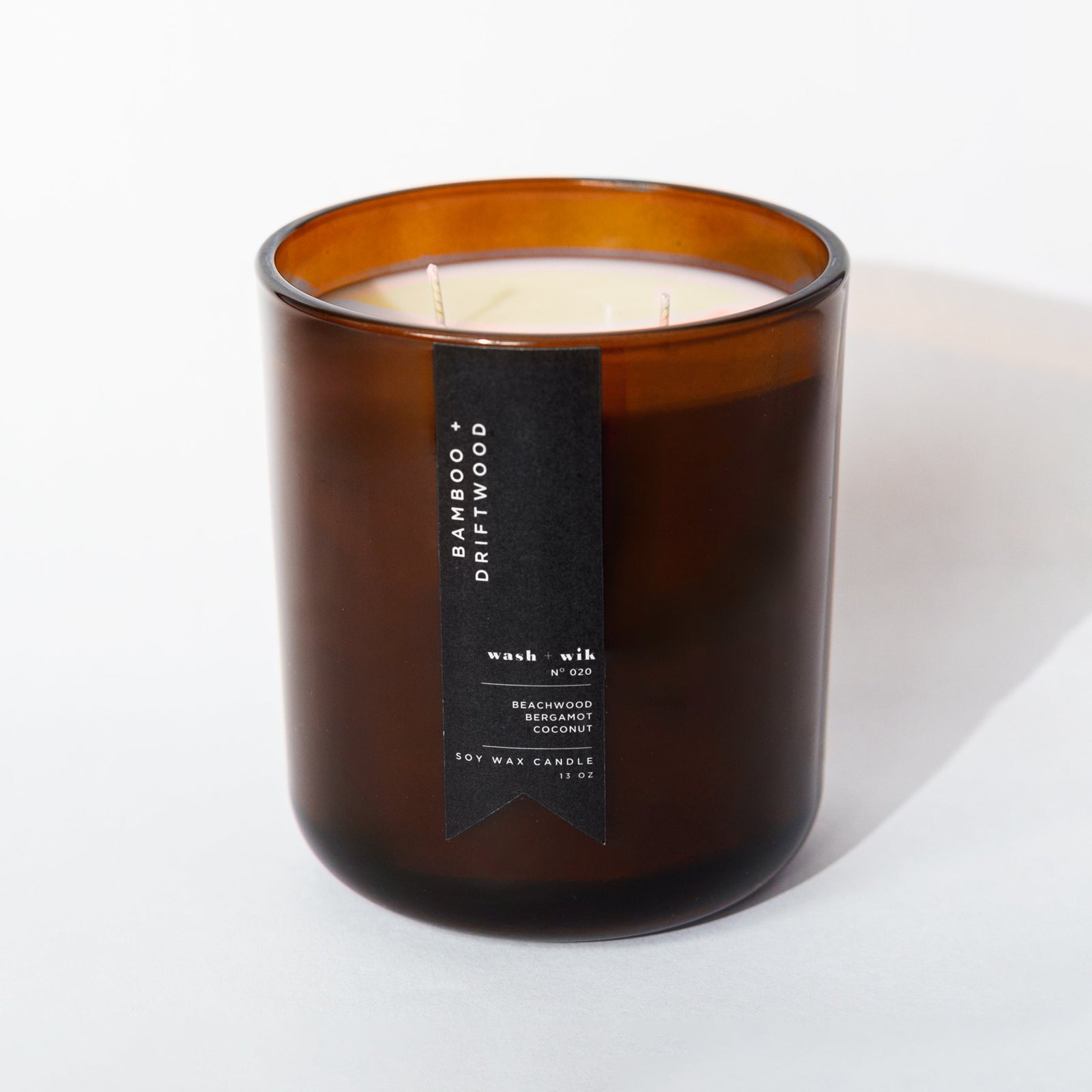 Brown candle with a label on a white background