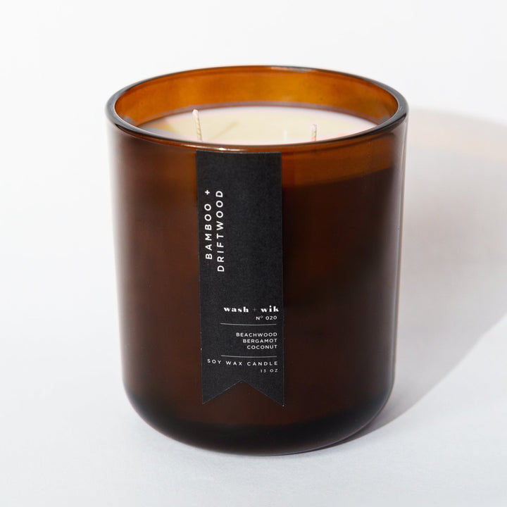 Brown candle with a label on a white background