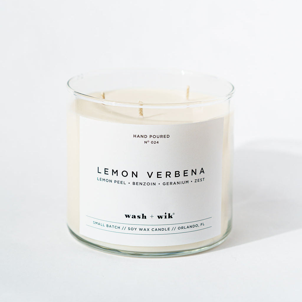 Lemon Verbena candle with a white label on a light background