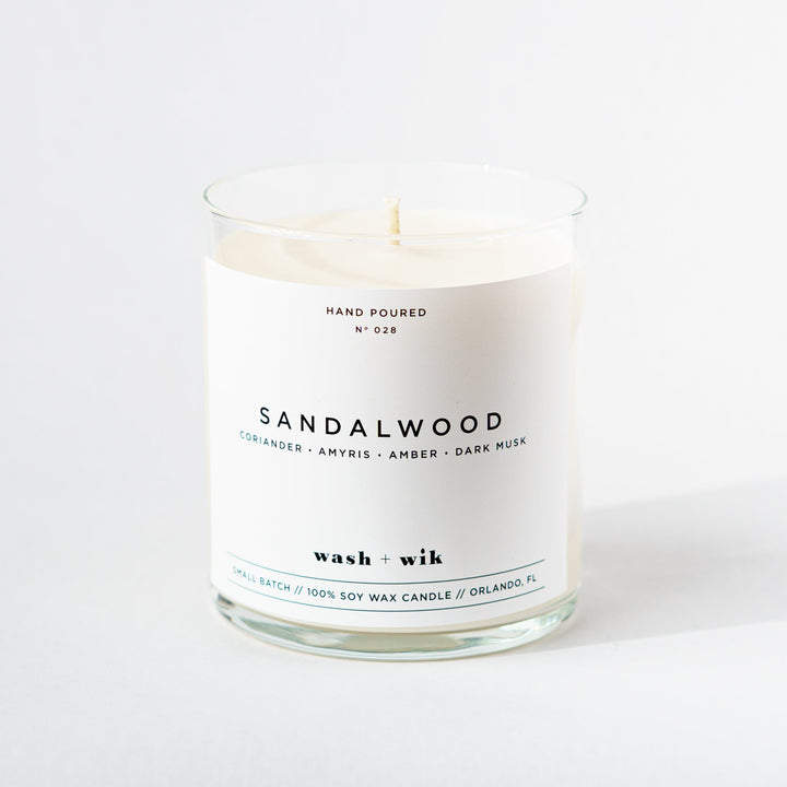 Sandalwood candle with a white label on a white background
