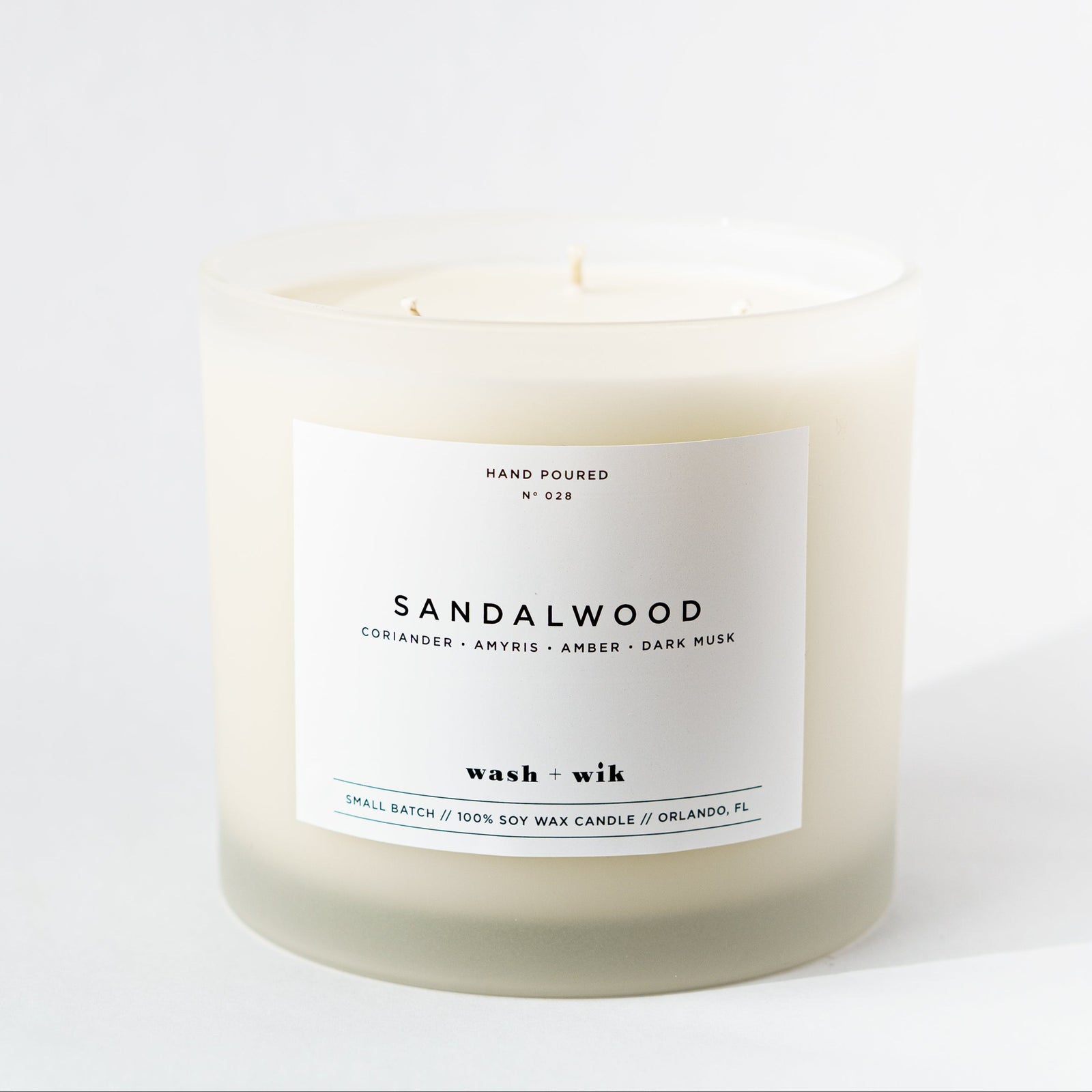 Sandalwood candle with a label on a white background
