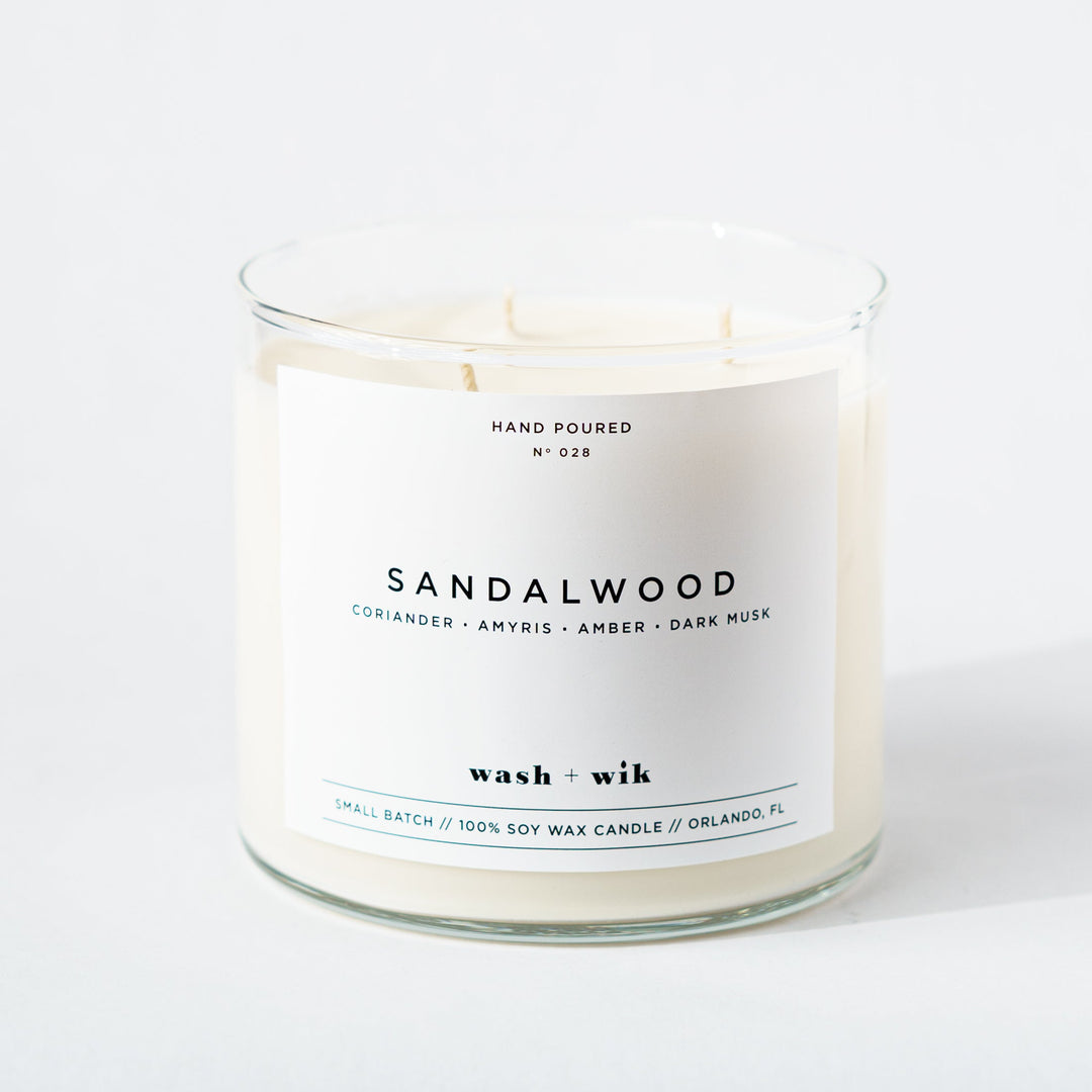 Sandalwood candle with a white label on a white background