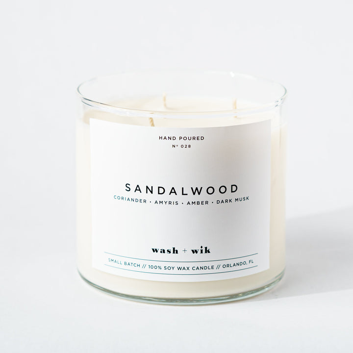 Sandalwood candle with a white label on a white background