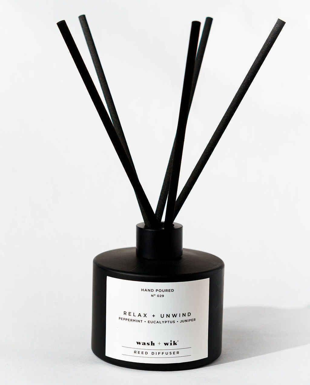 Black and white diffuser with sticks on a white background