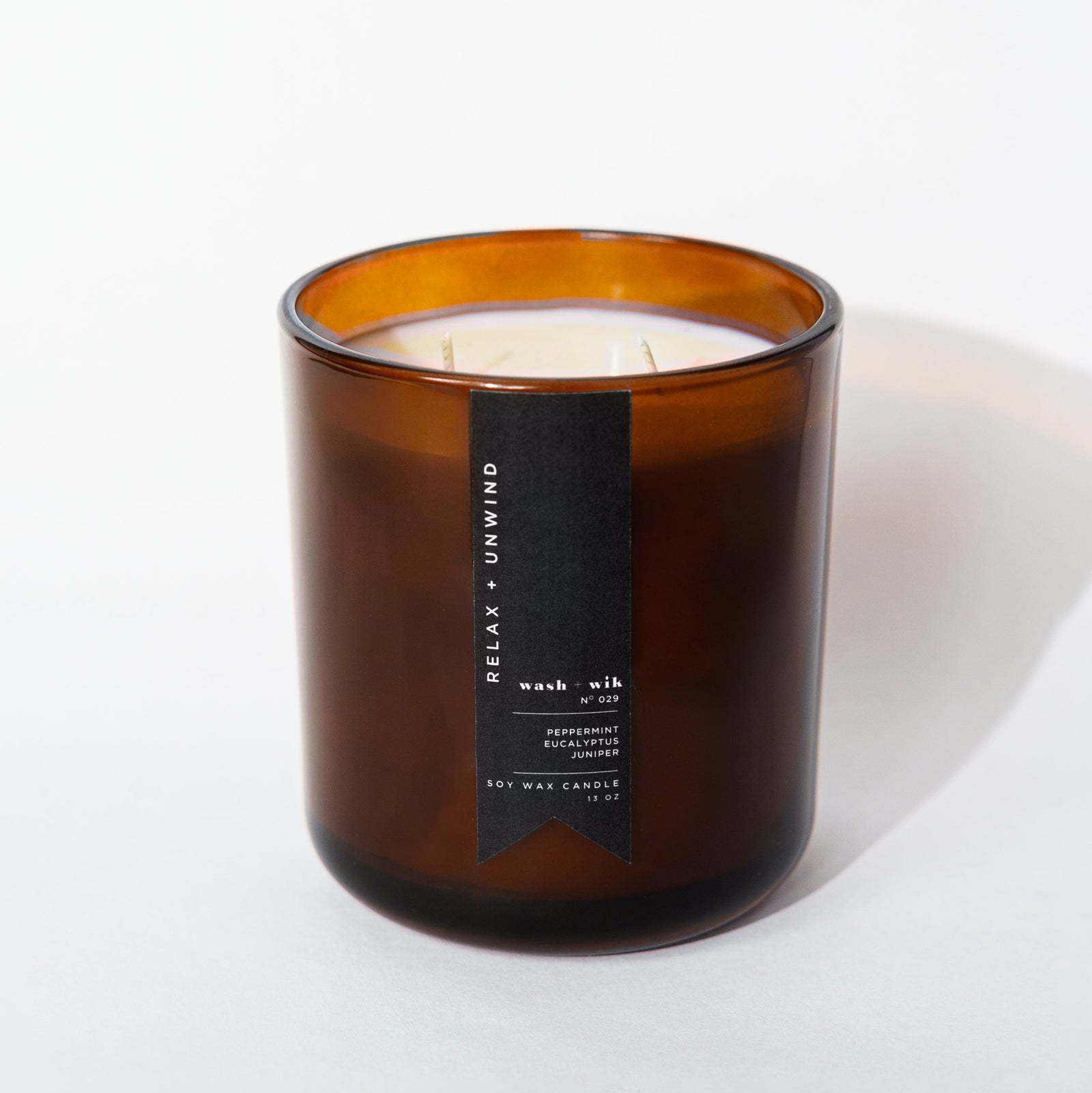 Brown candle with a label on a white background