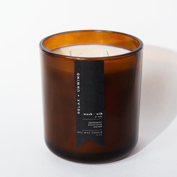 Brown candle with a label on a white background