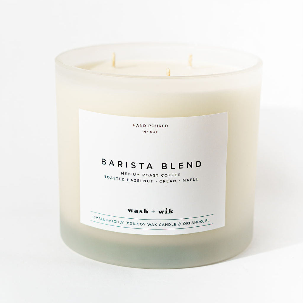 Candle labeled 'Barista Blend' on a white background