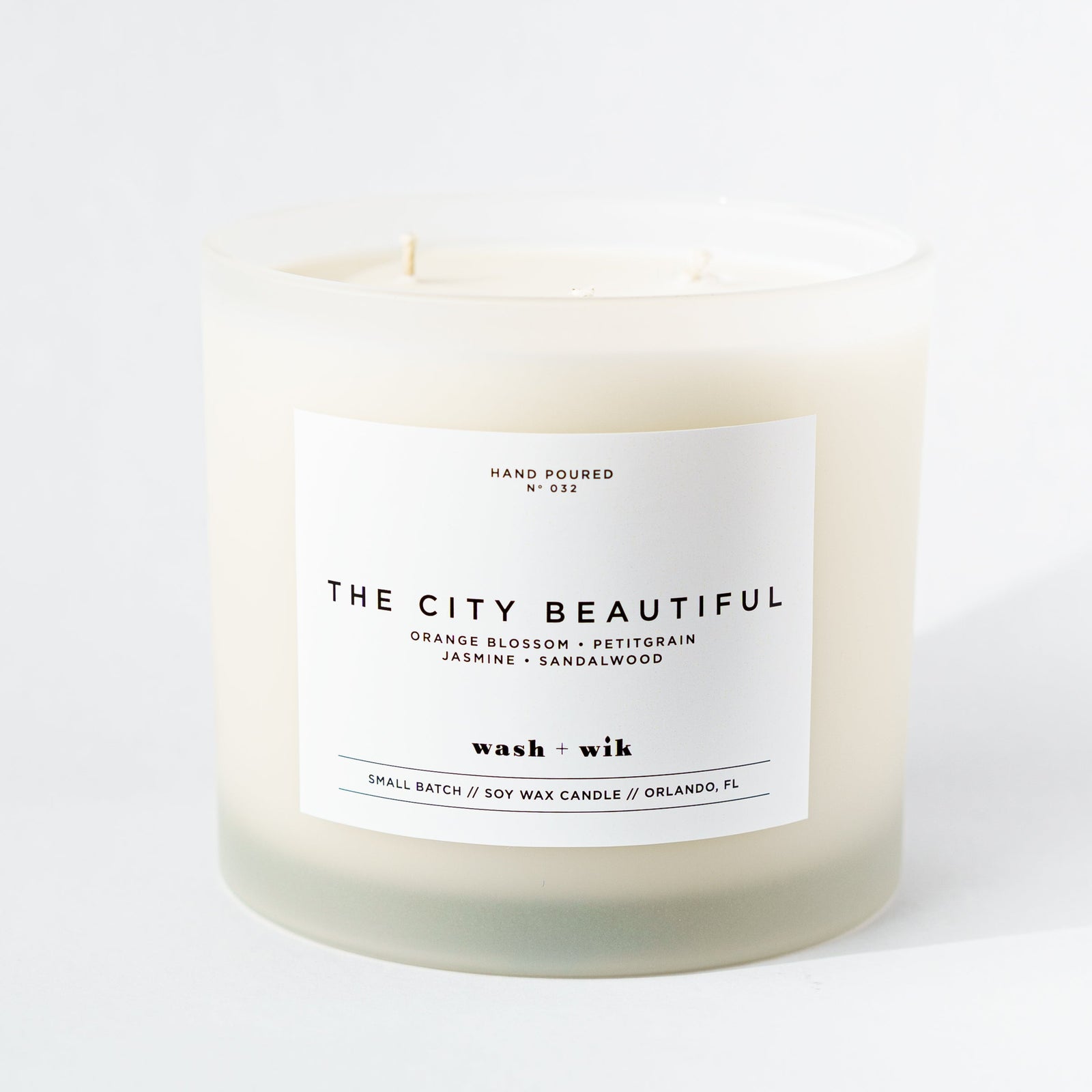 Candle labeled 'The City Beautiful' on a white background