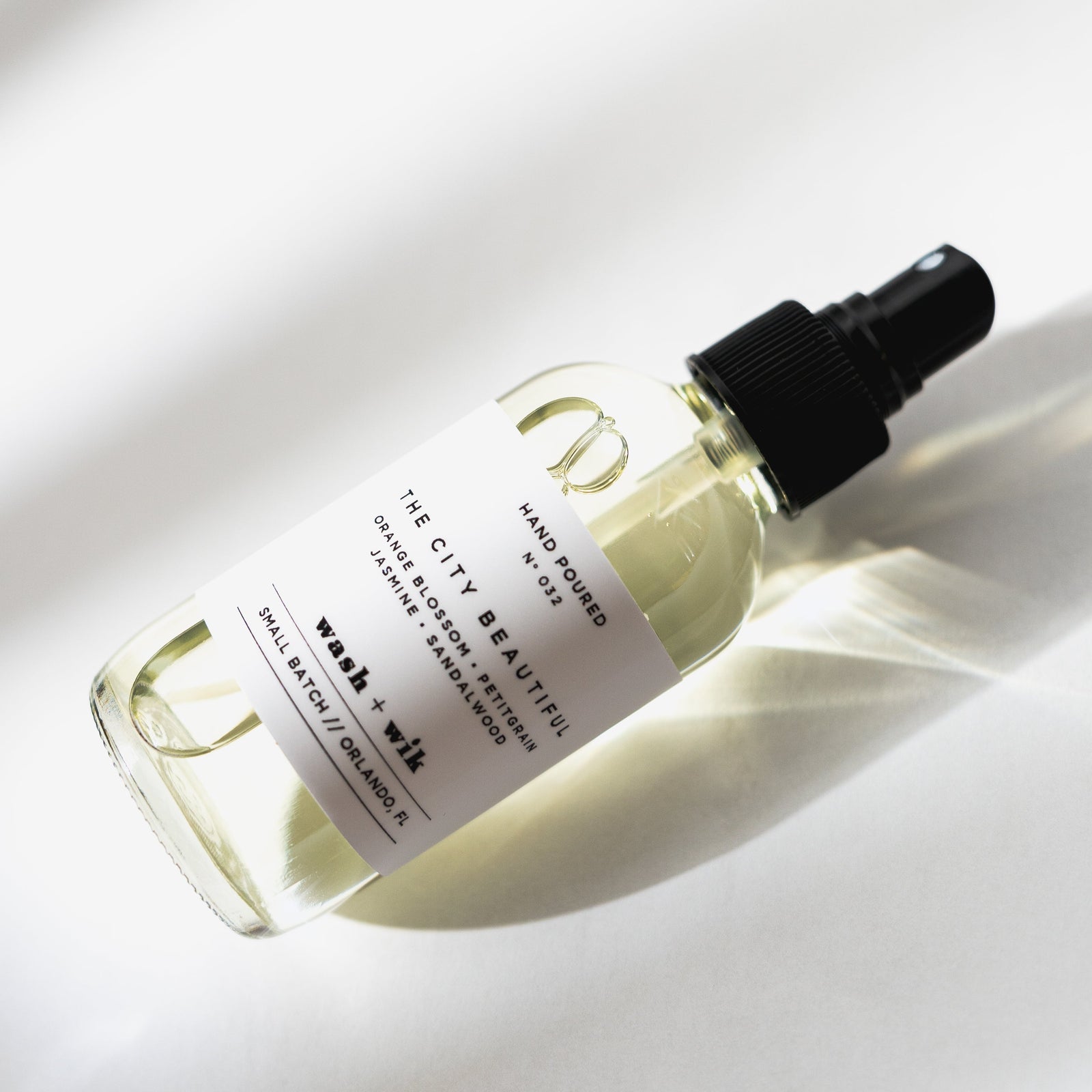 Skincare serum bottle with dropper on a light background