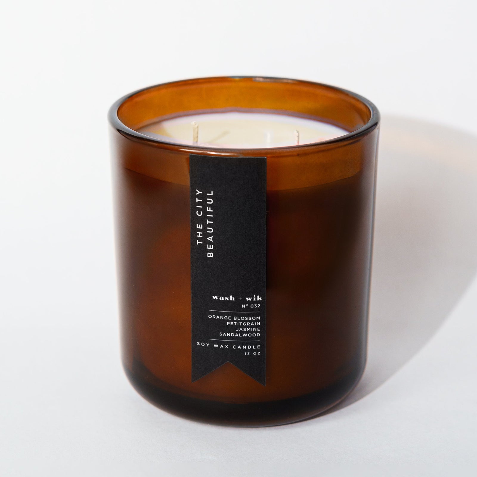 Brown candle with a label on a white background