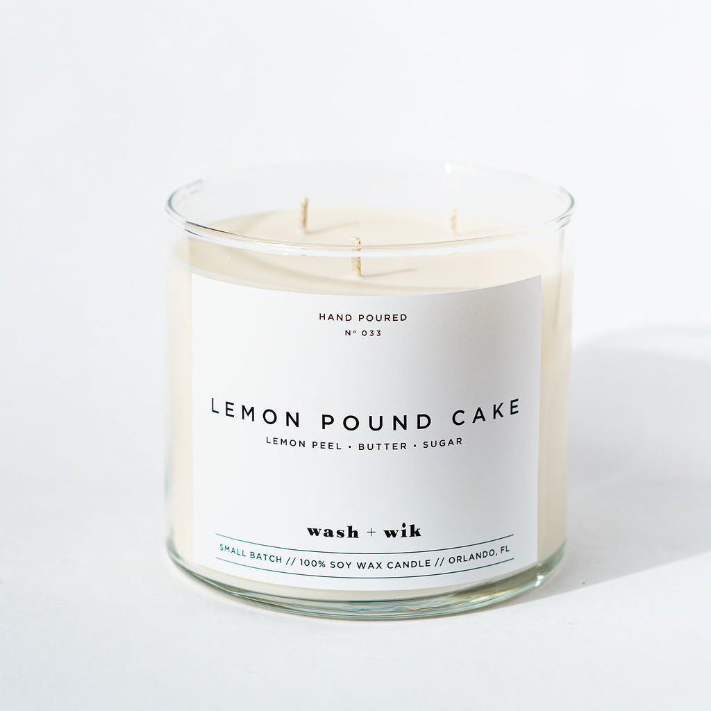 Lemon pound cake candle with a white label on a white background