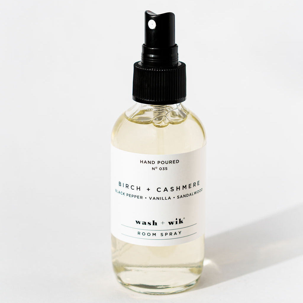 Bottle of Birch & Cashmere room spray on a white background