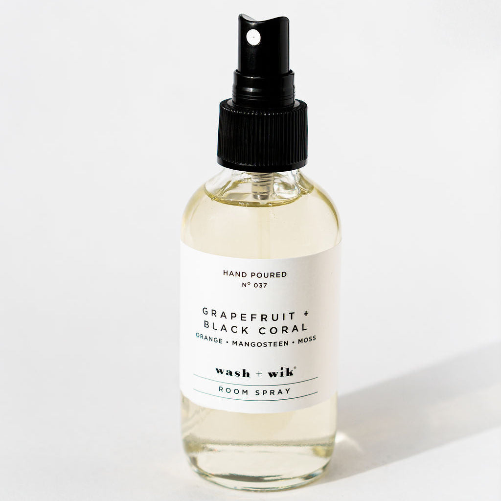 Room spray bottle with a label on a white background