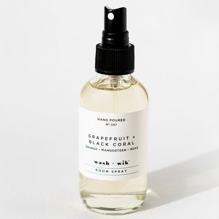 Room spray bottle with a label on a white background
