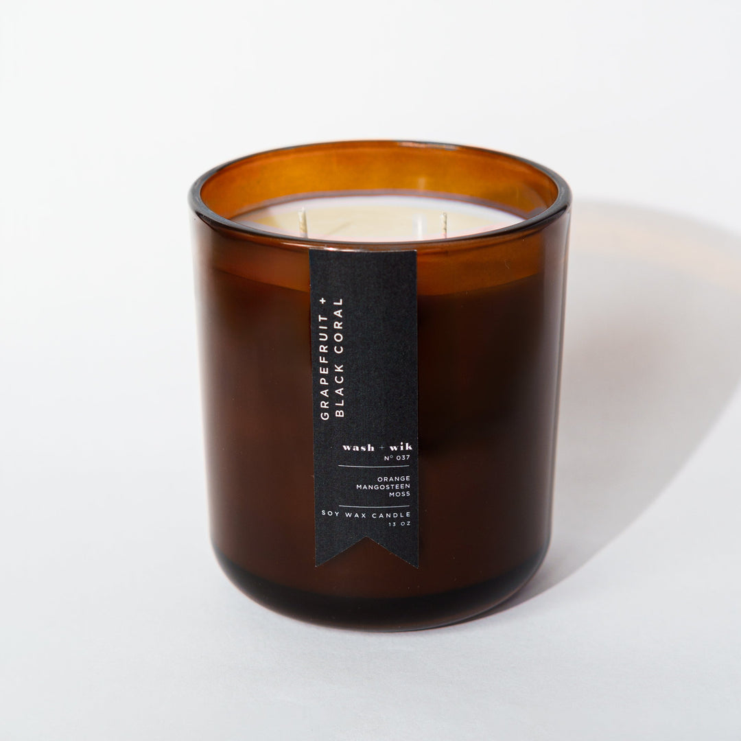 Brown candle with a label on a white background