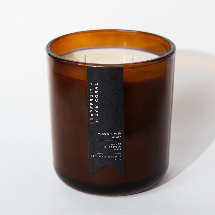 Brown candle with a label on a white background
