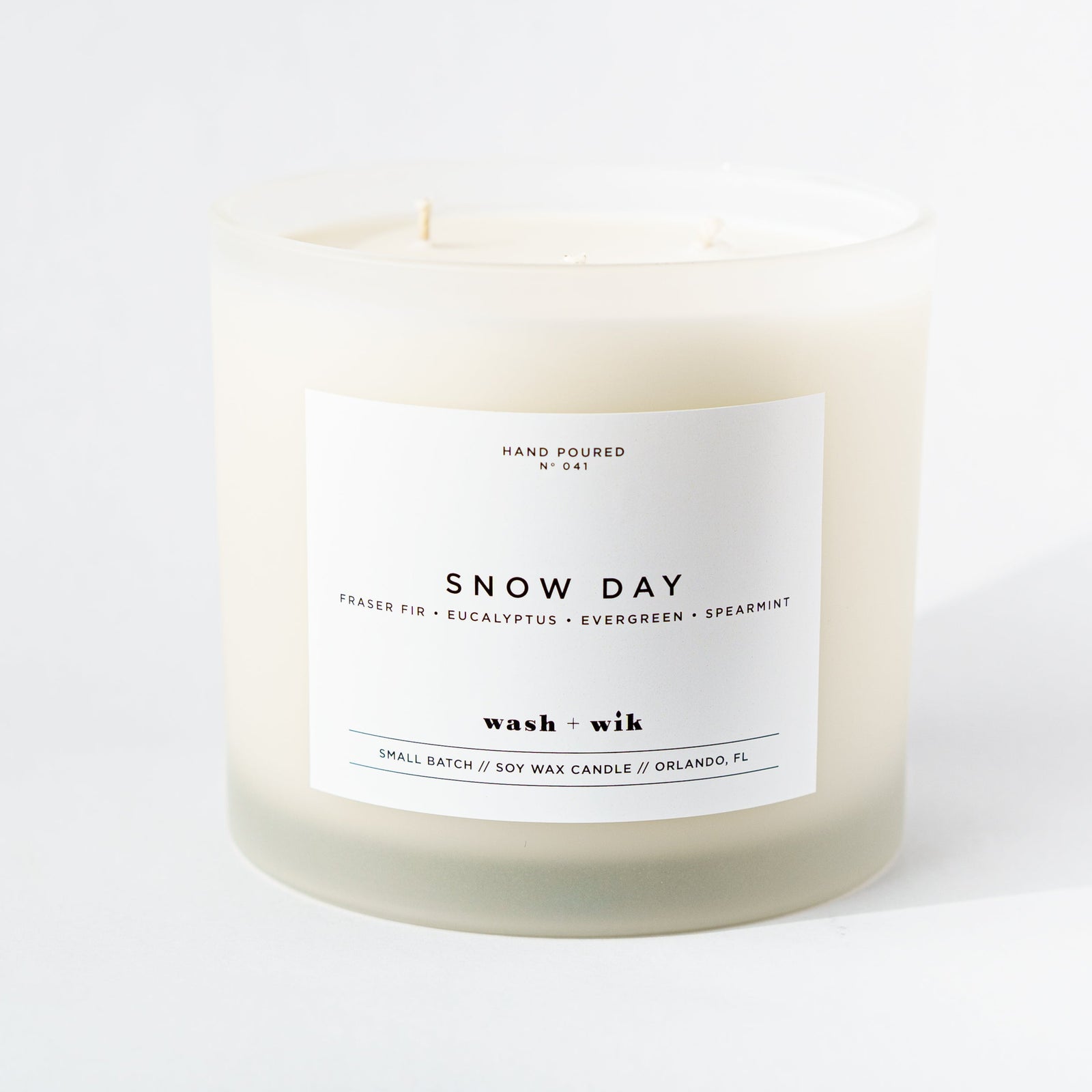 Snow Day candle with a white label on a white background