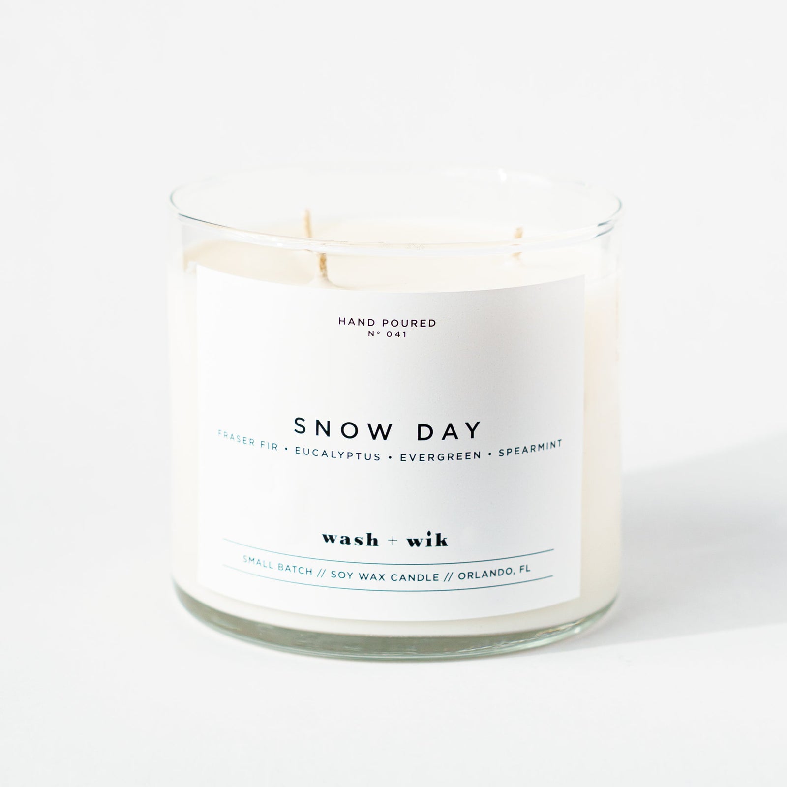 Snow Day candle with a white label on a white background