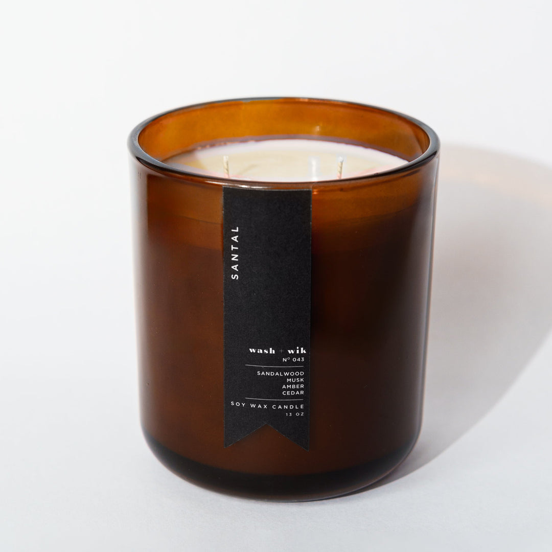 Brown candle with a label on a white background