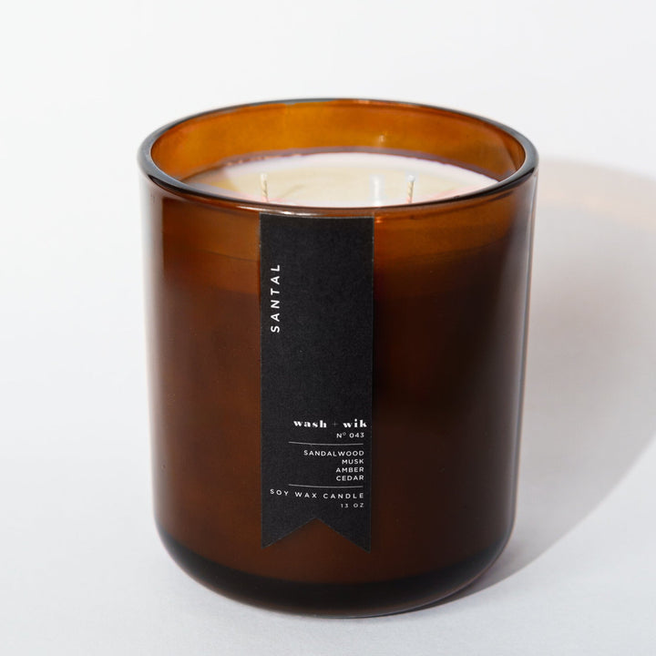 Brown candle with a label on a white background