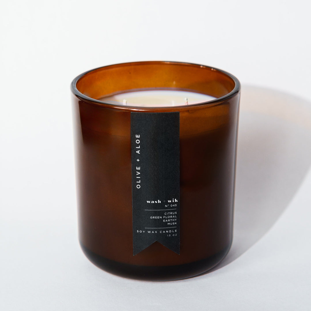 Brown candle with a label on a white background