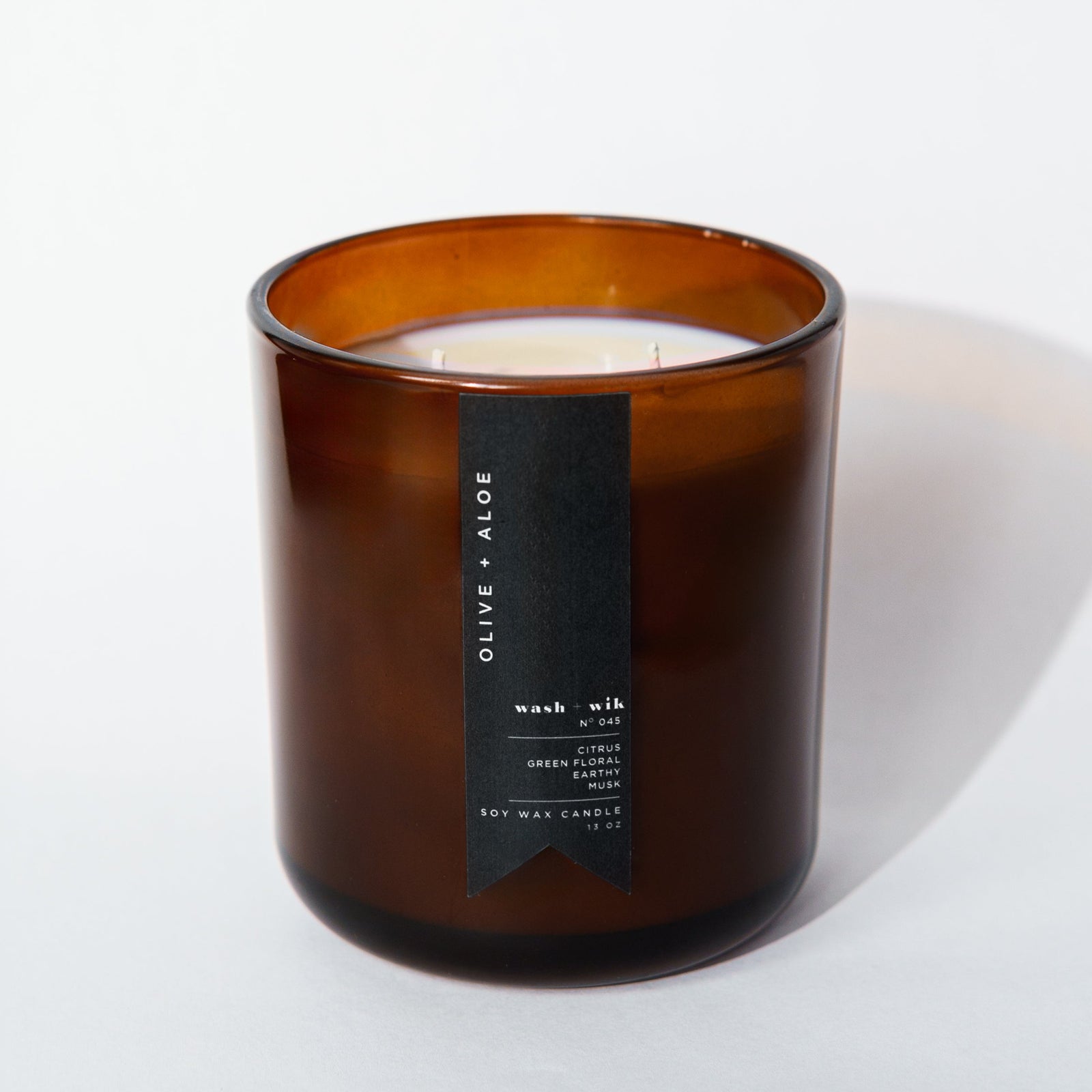 Brown candle with a label on a white background