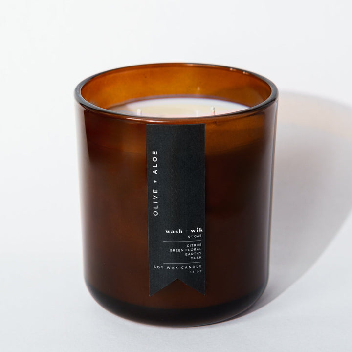 Brown candle with a label on a white background