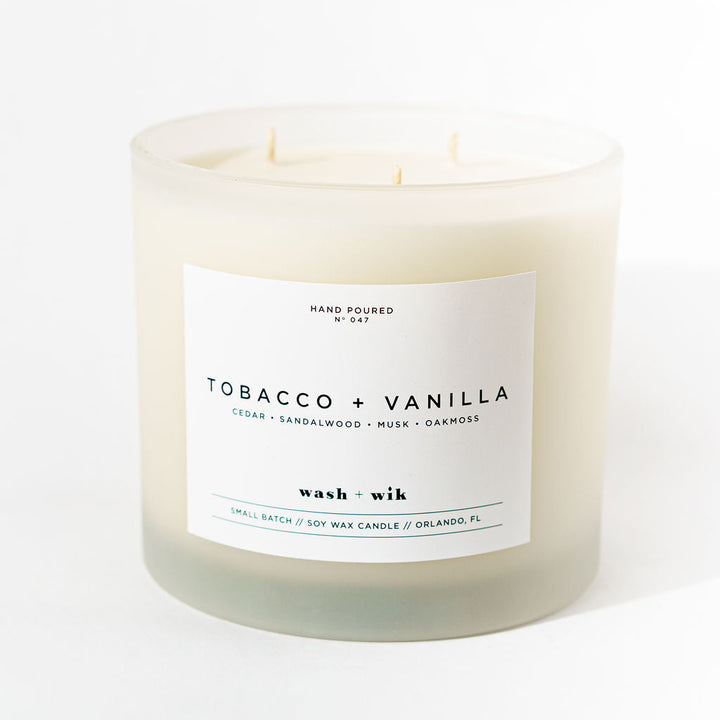 Candle with a label reading &