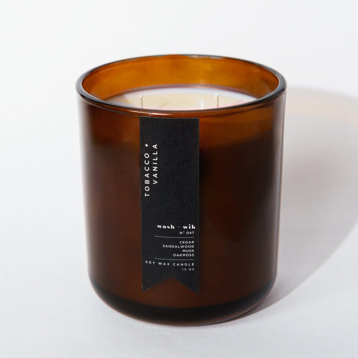 brown candle with black label and white background