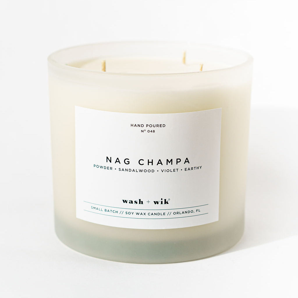 Nag Champa candle with a white label on a white background