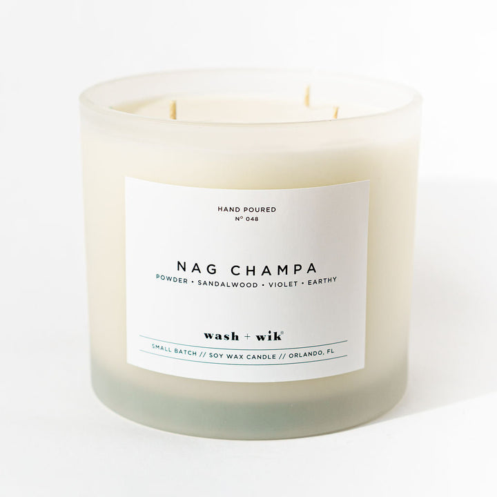 Nag Champa candle with a white label on a white background