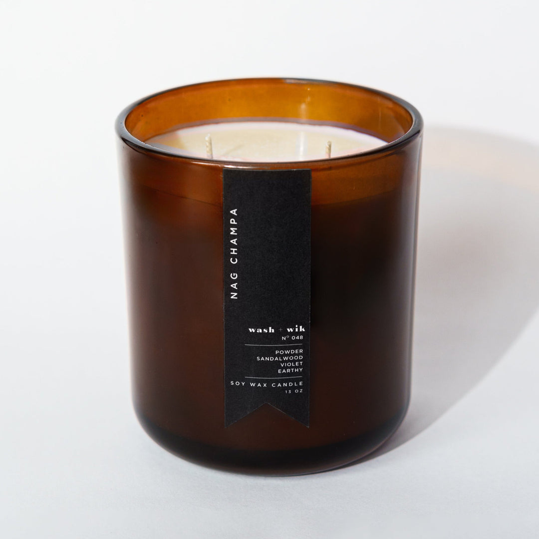 brown candle with black label and white background