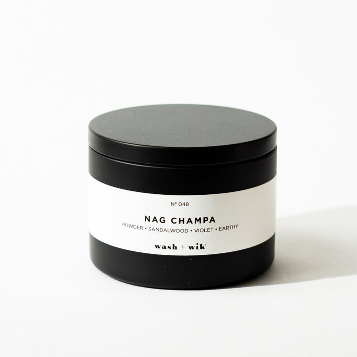 Black tin candle on white background