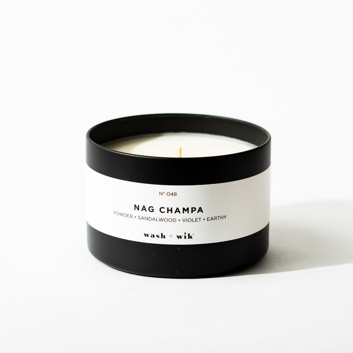 Black tin candle on white background