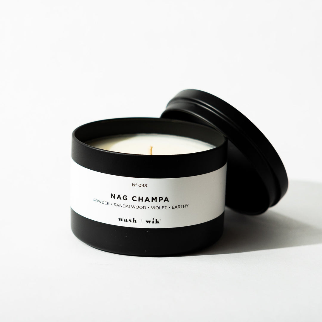 Black tin candle on white background