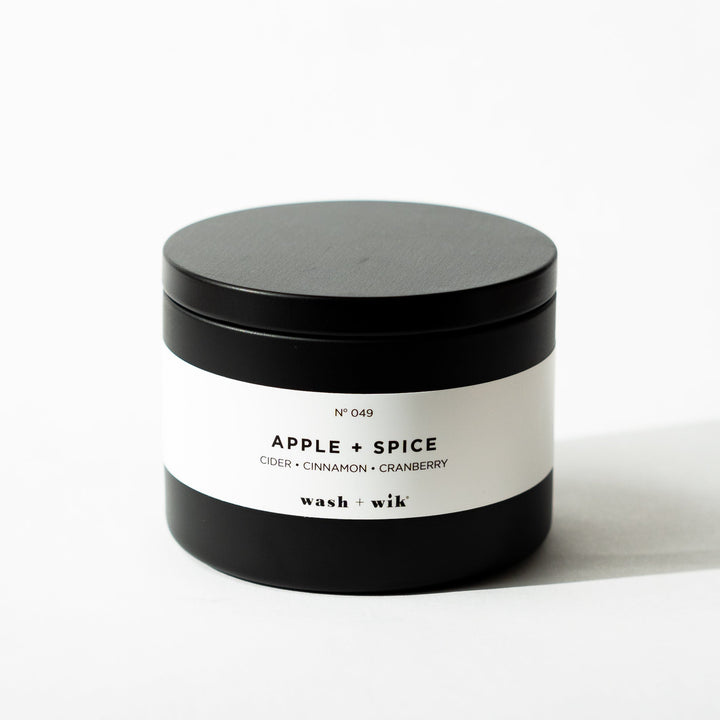 Black tin candle on white background